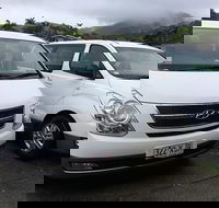 IMAX Private Transfer 7 Guests Cairns Airport to Palm Cove - E Caravan Parks