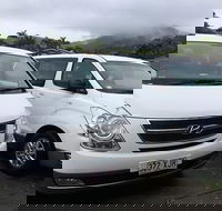 IMAX Private Transfer 7 Guests Cairns Airport to Hotels in Cairns City - E Caravan Parks