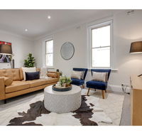 Large stylish and quiet penthouse steps from surf - E Caravan Parks