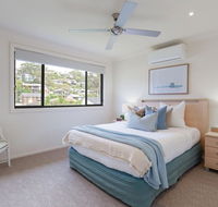 'Sandy Point Haven' 21a Sandy Point Rd - Stylish Haven with WIFI Air conditioning  Water views - E Caravan Parks